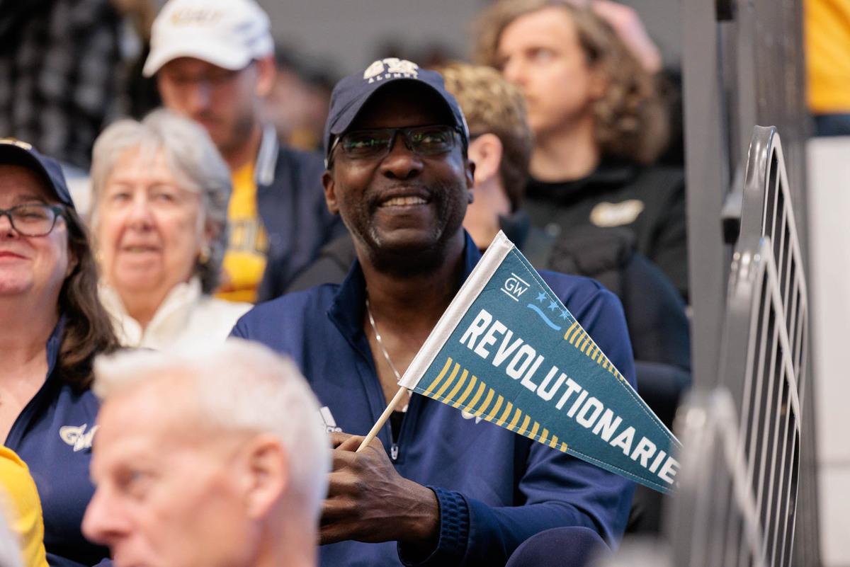 Fan holding Revolutionaries pennant